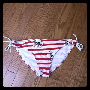 Red and white skull striped bathing suit bottoms
